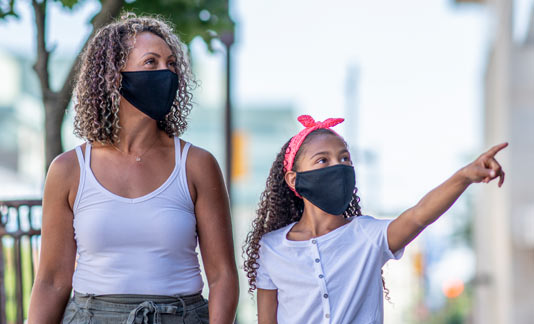 Mother and daughter wearing face masks