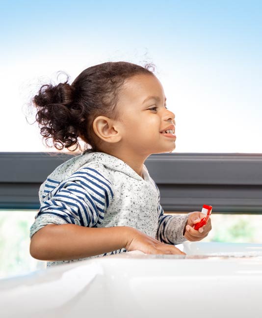 Young girl brushing her teeth